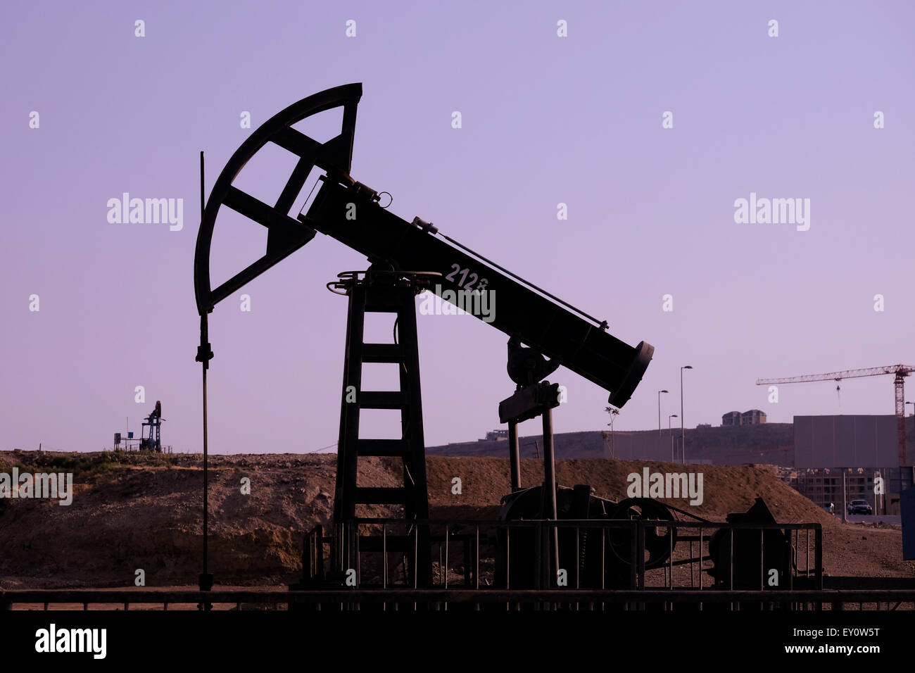 A pump-jack in an oil well in the city of Baku capital of Azerbaijan Stock Photo