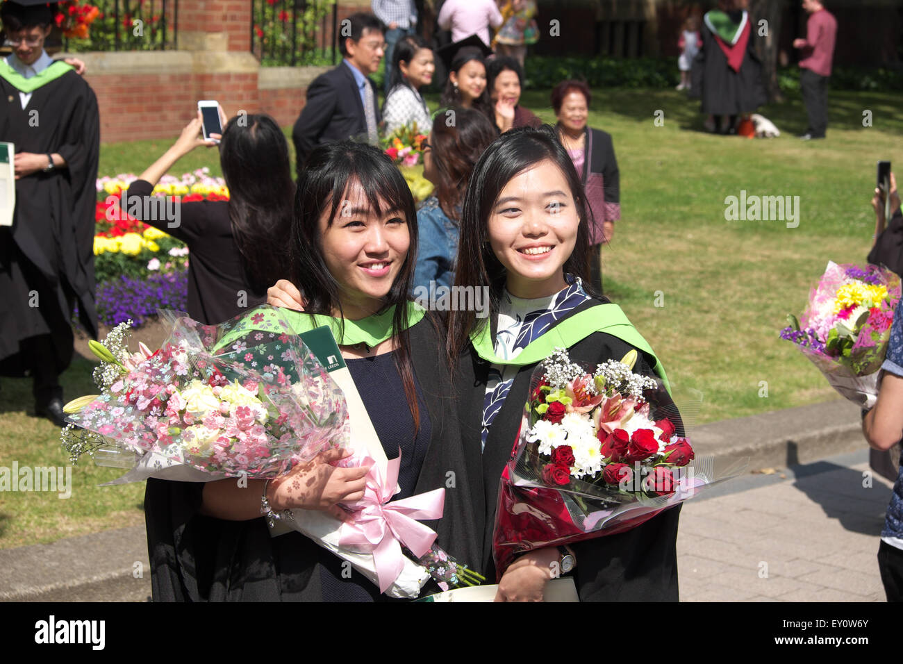 Student Graduation Day at the University of Leeds for two young female asian students July 2015 Stock Photo