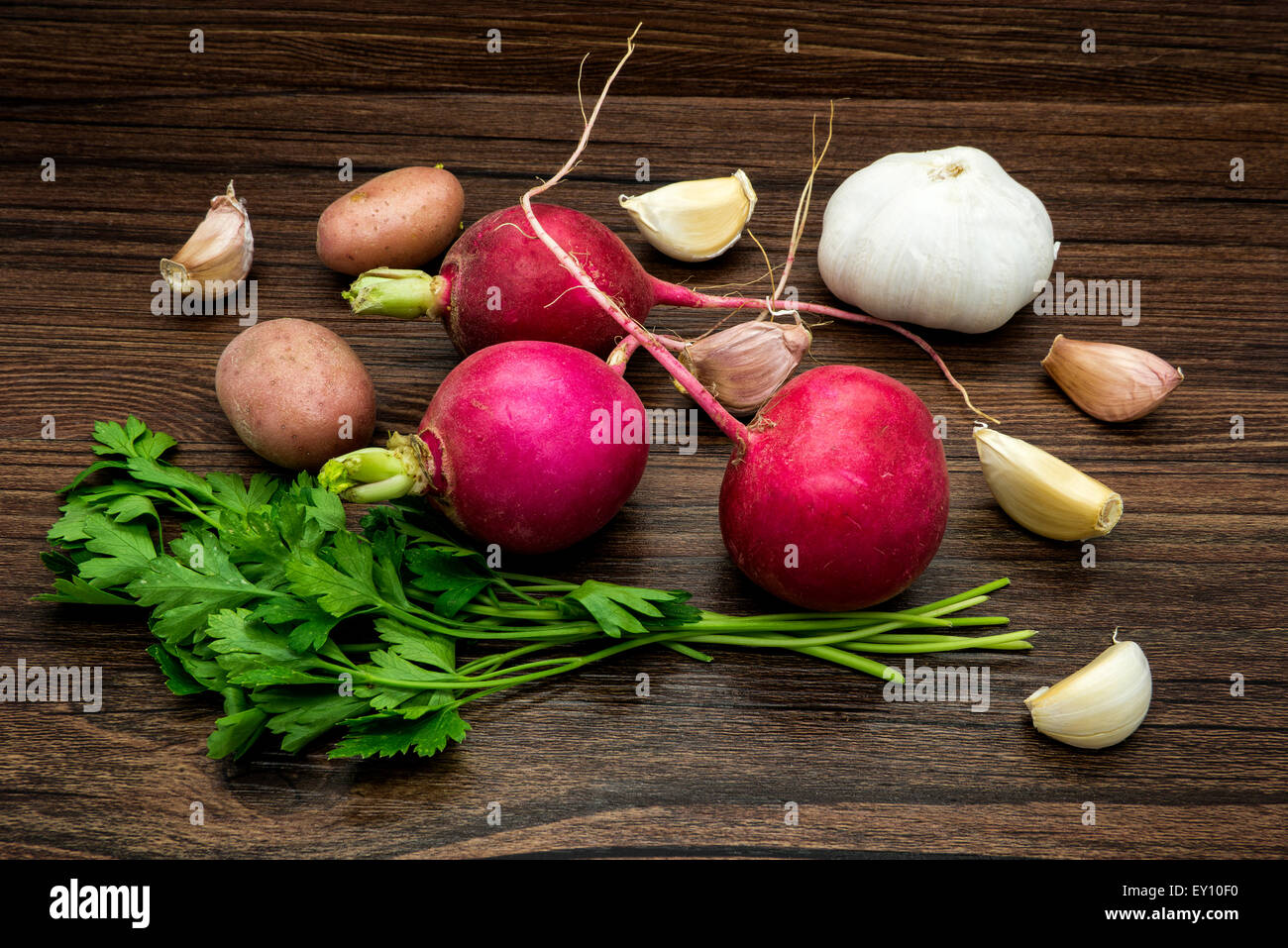 Vegetables still life on a wooden table brown color. Stock Photo