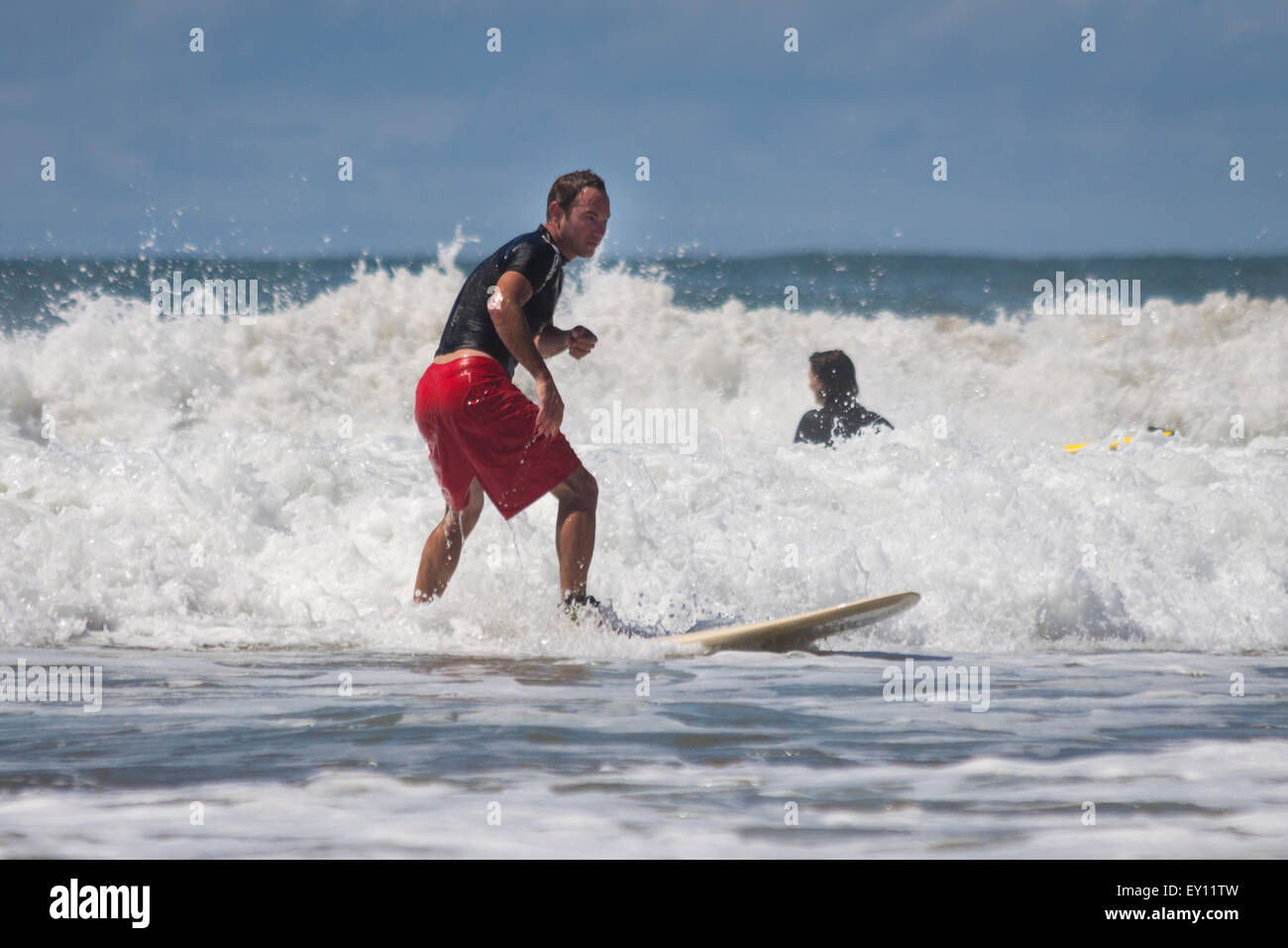 Beginner surfers on Playa Maderas, Nicaragua Stock Photo
