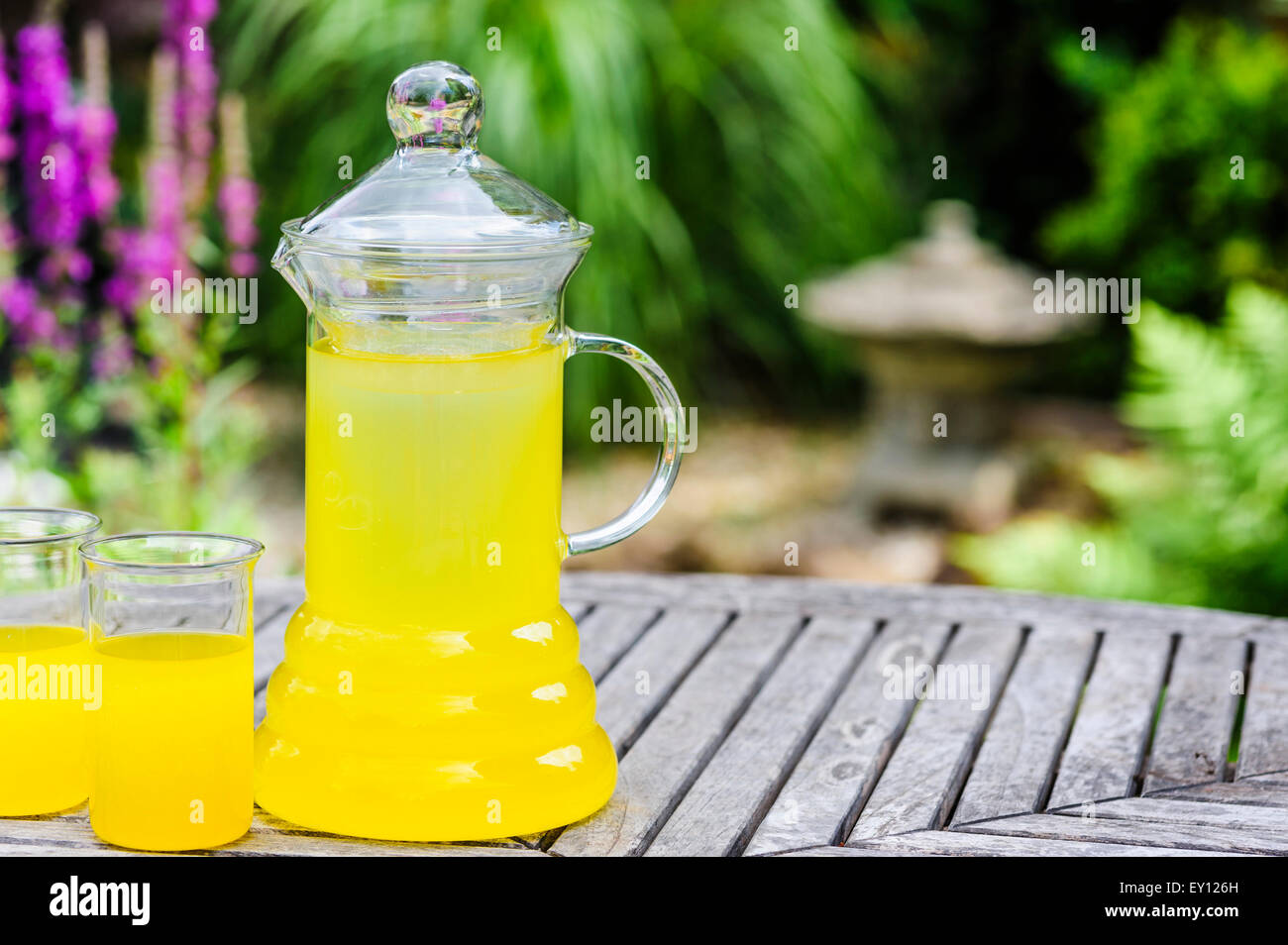 Jug of chilled orange juice and two glasses Stock Photo Alamy