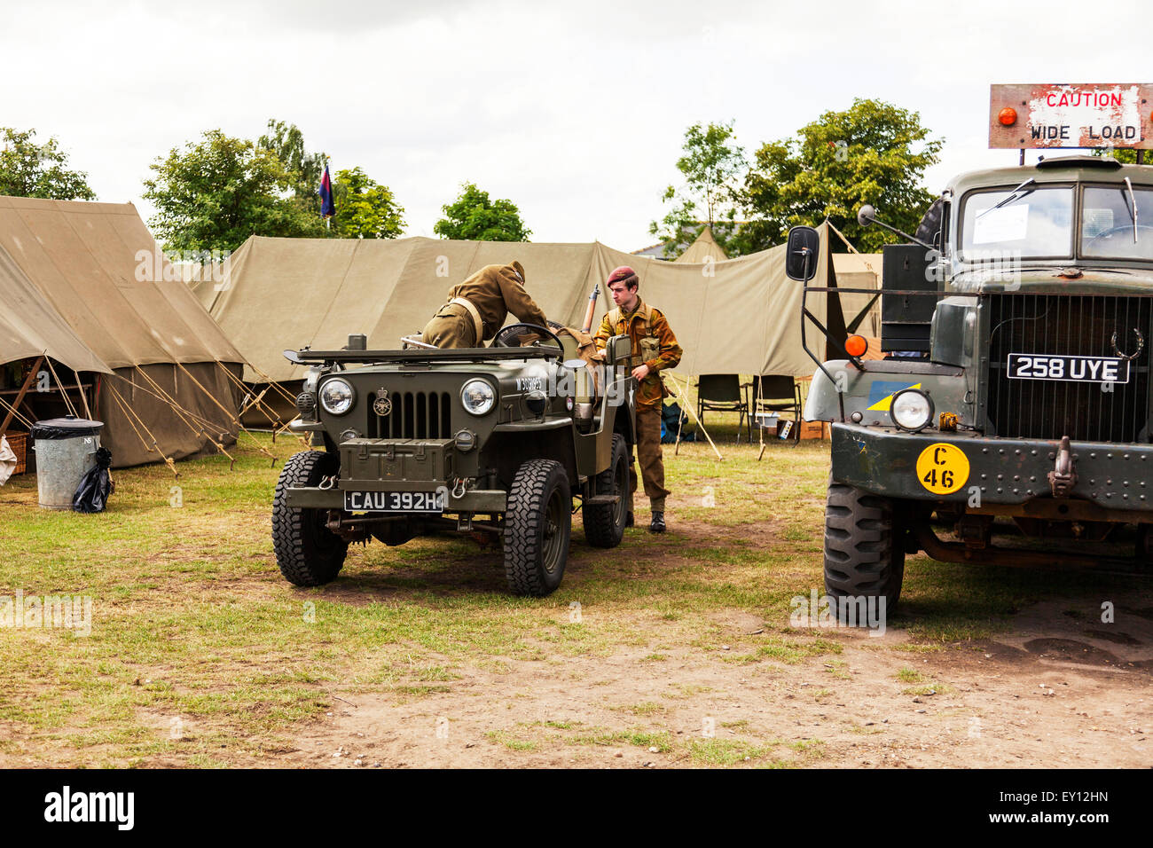 Woodhall Spa, Lincolnshire, UK. 19th July, 2015. 1940's Weekend at Woodhall Spa Lincolnshire UK England on 19/07/2015 People and vehicles from the WW1 World War 1 era veterans in traditional dress uniform uniforms and attire. Huge vintage event as the sunny weather draws the crowds to revel in a day of vintage music, dance, fashion, memorabilia, entertainment and classic cars on a 1940's theme. They enjoy live vintage music, classic cars & military vehicles, dancing displays & re-enactments Credit:  Tommy  (Louth)/Alamy Live News Stock Photo