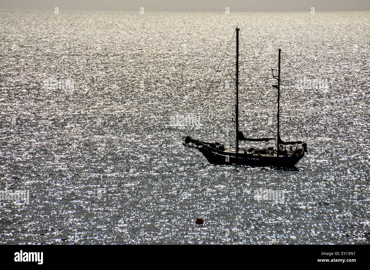 Silhouette Boat in the Ocean Stock Photo - Alamy