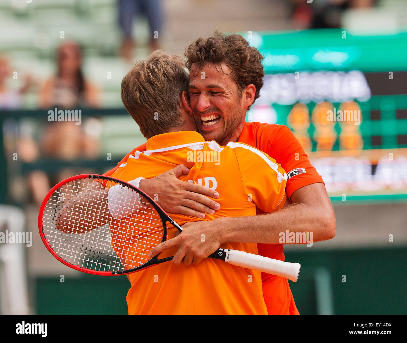 Austria. 19th July, 2015, Tennis,  Davis Cup, forth match between Dominic Thiem (AUT) and Robin Haase (NED), pictured: Robin Haase celebrates his win and put the Dutch in a 3-1 win, captain Jan Siemerink is embracing him  Credit:  Henk Koster/Alamy Live News Stock Photo