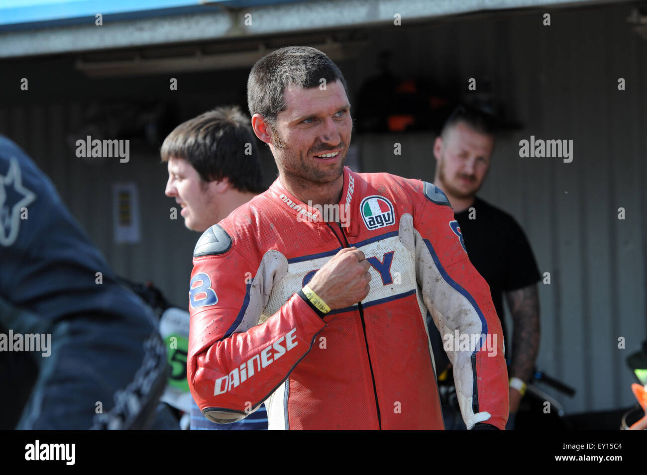 Kings Lynn, Norfolk, UK. 18/07/2015. Dirt Quake IV. Racing on a dirt track Guy Martin in red leathers in the pit. ©Becky Matthews Stock Photo