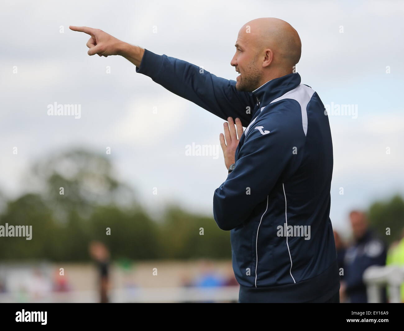 Nantwich, UK. 19th July, 2015. Nantwich Town manager Phil Parkinson offers instructions from the dugout during the pre-season friendly match at The Weaver Stadium, Nantwich as Nantwich Town entertained Crewe Alexandra. Credit:  SJN/Alamy Live News Stock Photo