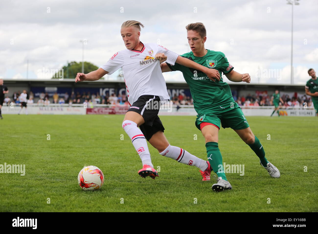 Nantwich, UK. 19th July, 2015. Nantwich Town's  Chris Speed battles for the ball with Crewe Alex's George Cooper during the pre-season friendly match at The Weaver Stadium, Nantwich as Nantwich Town entertained Crewe Alexandra. Credit:  SJN/Alamy Live News Stock Photo