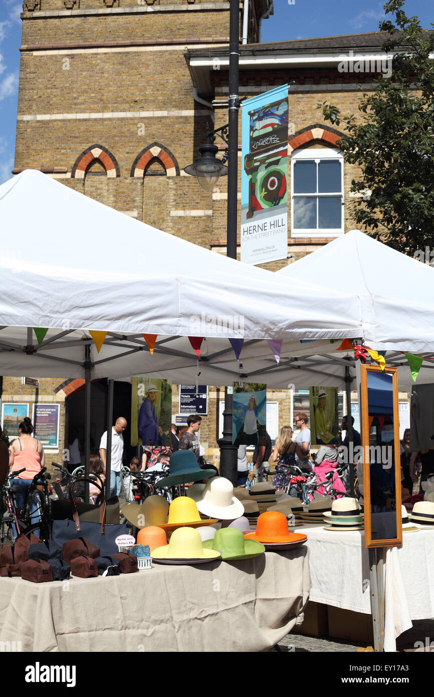 A stall selling hats at the City & Country Farmers' market in Herne Hill, London SE24 Stock Photo