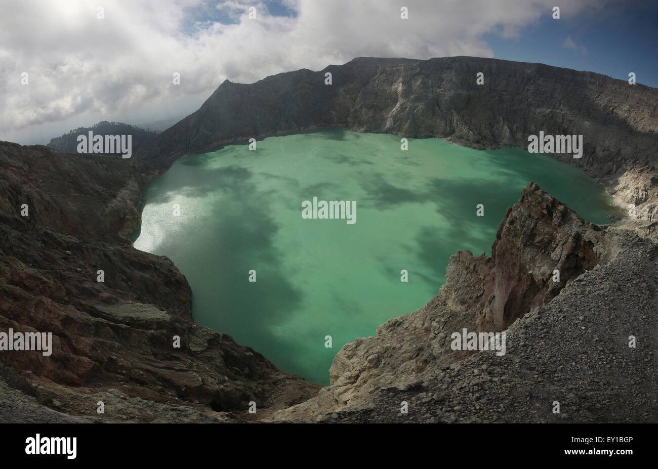 Acid lake in the crater of the active volcano of Kawah Ijen in East Java, Indonesia. The panorama has composed from 6 photograph Stock Photo