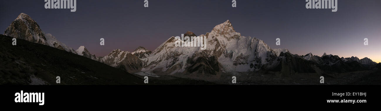 Sunset over Mount Everest (8,848 m) and Mount Nuptse (7,861 m) in Khumbu region, Himalayas, Nepal. Panorama from the point on th Stock Photo