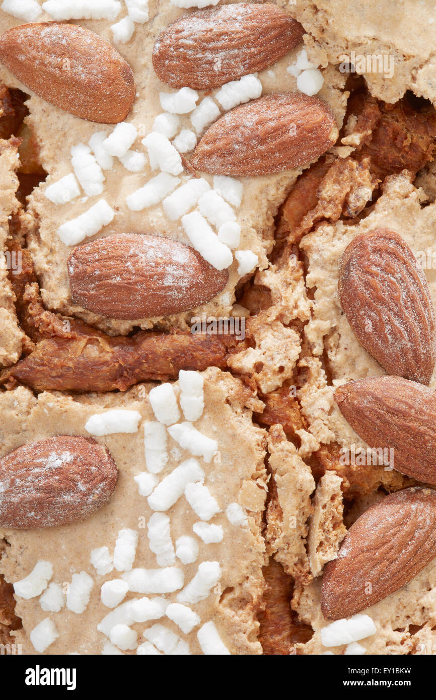 Colomba, Italian Easter cake frosting with almonds background Stock Photo