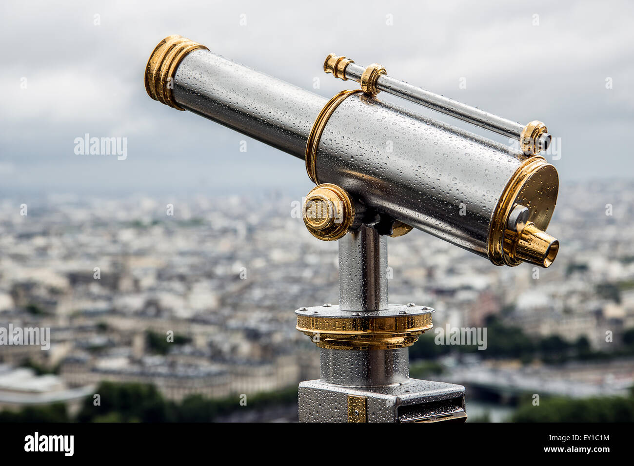 Wet telescope on top the Eiffel Tower Stock Photo