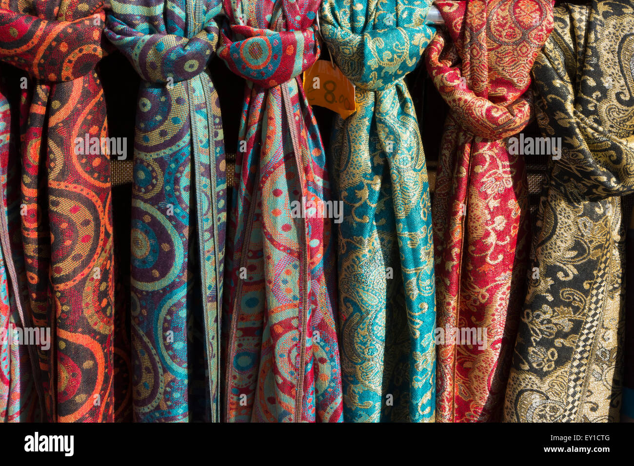 Colourful Scarves for sale on Market Day in Piazza delle Erbe, Verona in Italy Stock Photo