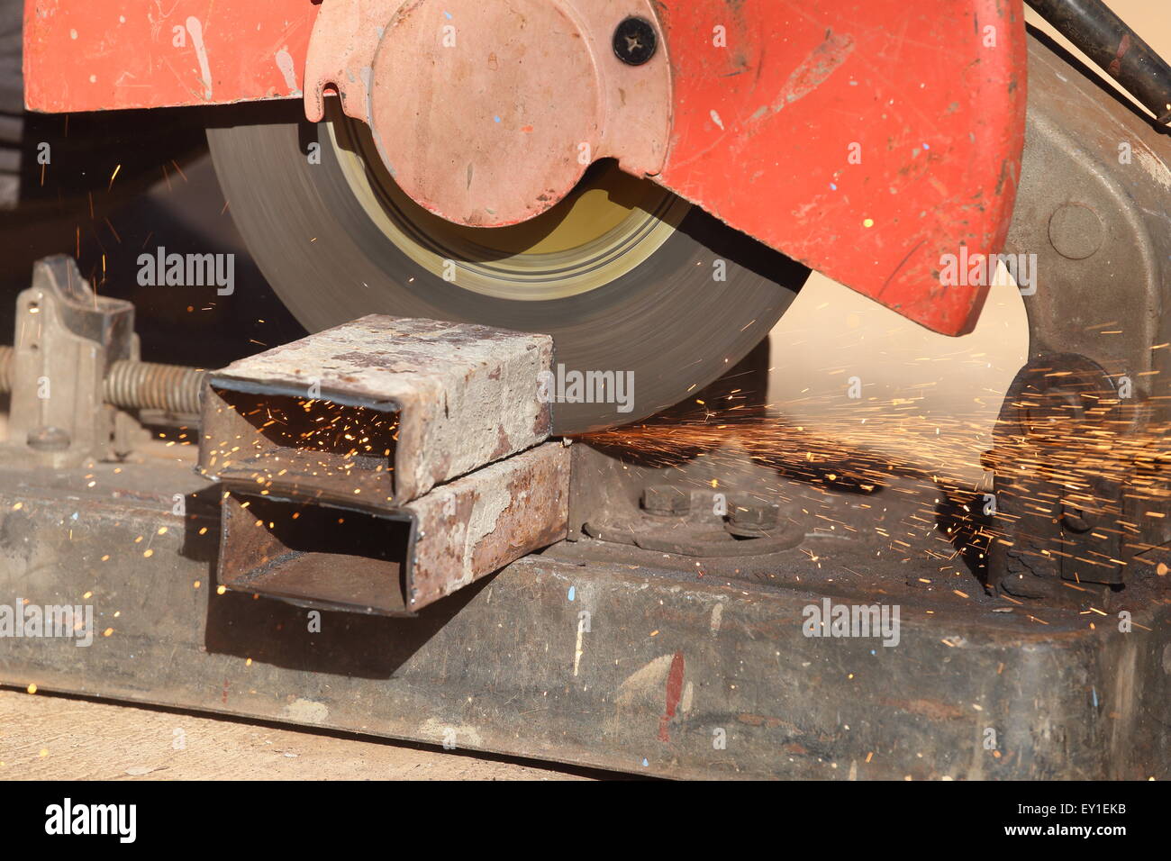 cutting a metal and steel with compound mitre saw with sharp, circular