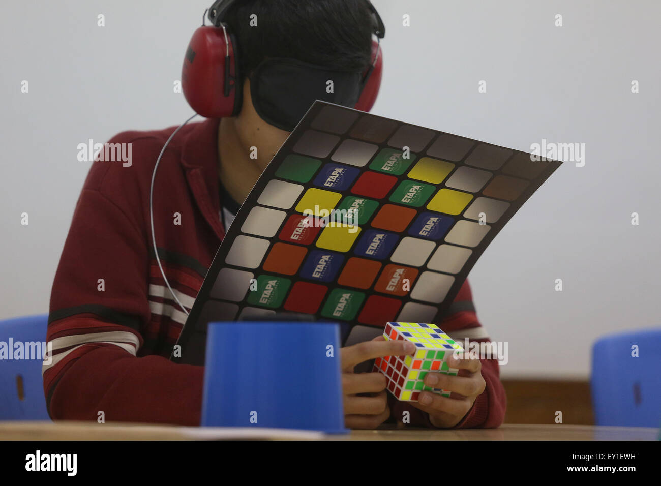 Sao Paulo. 19th July, 2015. A blindfolded competitor tries to solve Rubik's cubes during the 8th Rubik's Cube World Championship in Sao Paulo, Brazil on July 19, 2015. According to local press, around 400 competitors from 40 countries took part in the 2015 event. © Rahel Patrasso/Xinhua/Alamy Live News Stock Photo