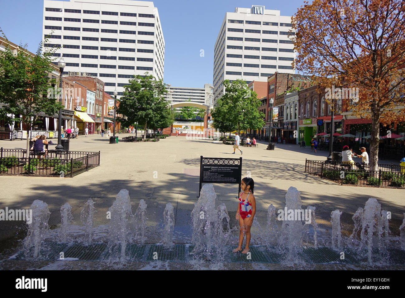 Little girl plays in a water fountain at Market Square, downtown