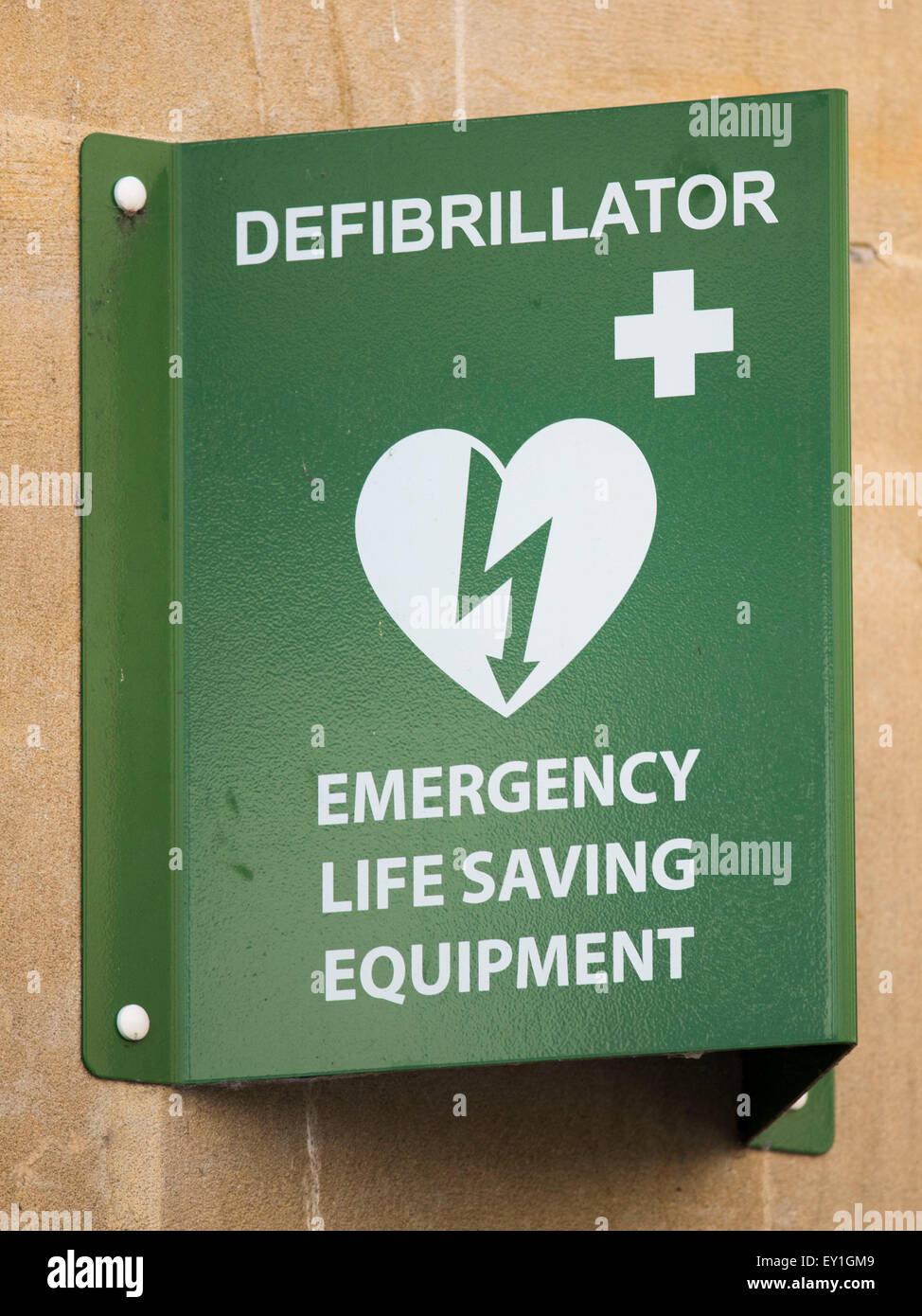 A defibrillator sign. Defibrillators are  used to stabilise an irregular heartbeat. and are often found in public areas. Stock Photo