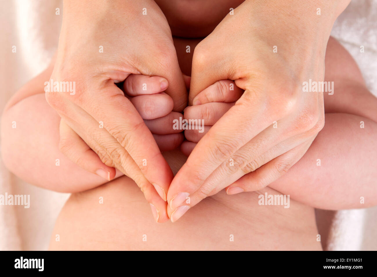 Close-up of human hands gesturing with heart shape, Stock Photo
