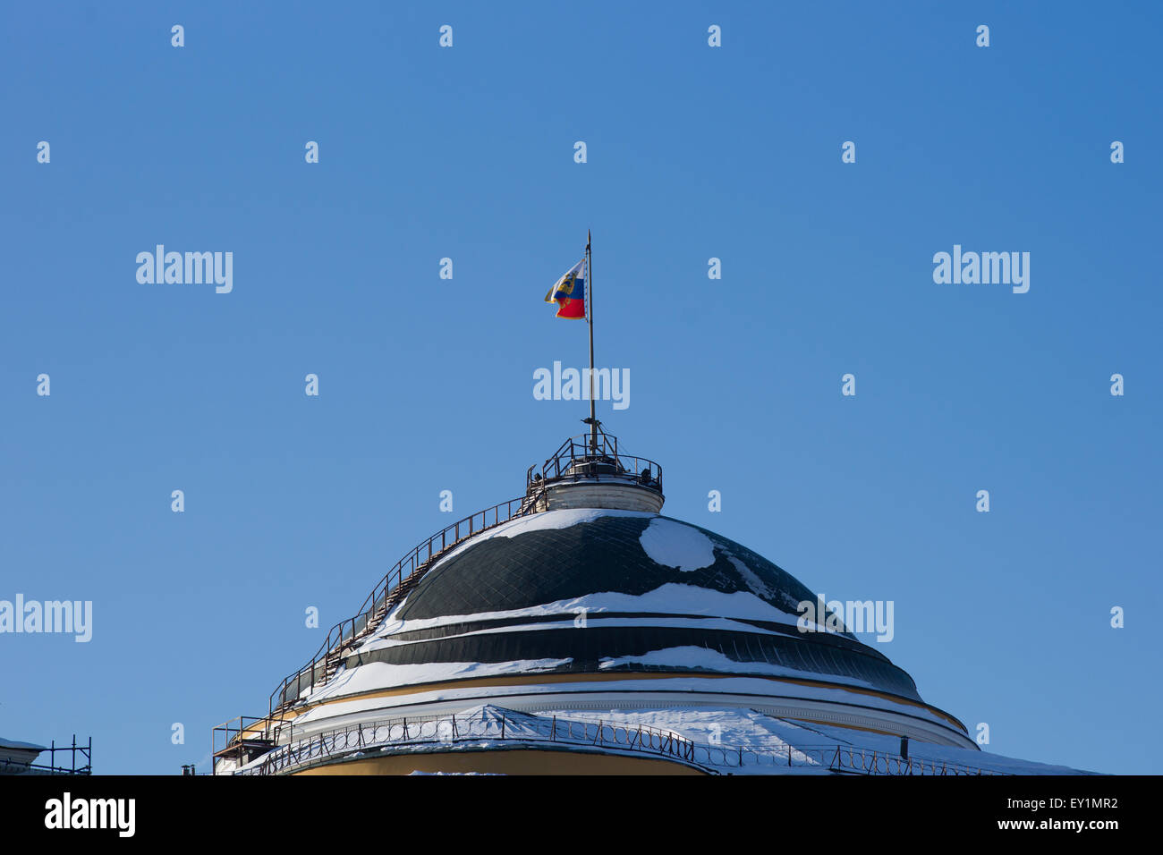 Dome of Senate building of Moscow Kremlin and the Standard of the President of the Russian Federation in winter Stock Photo