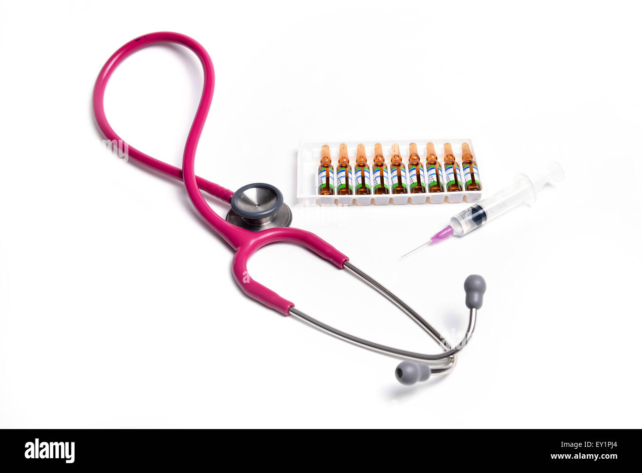 ampule syringe and stethoscope on white table Stock Photo