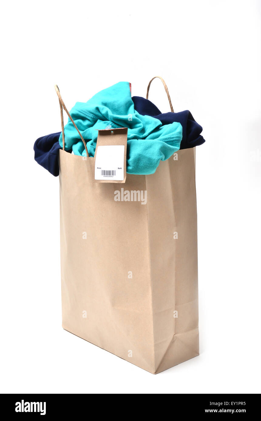 clothes with price tag in a shopping bag Stock Photo
