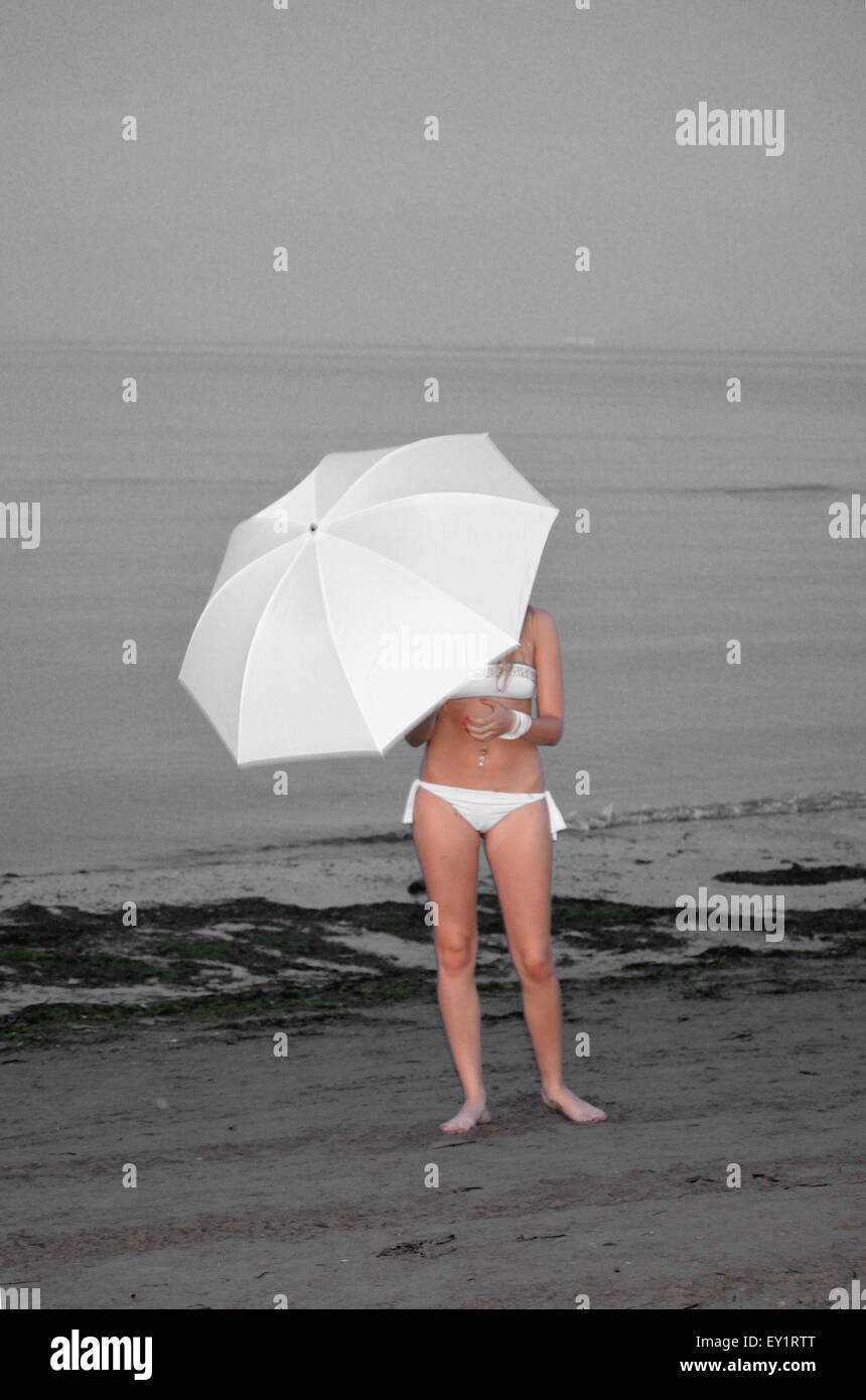 girl with umbrella with background in black and white Stock Photo