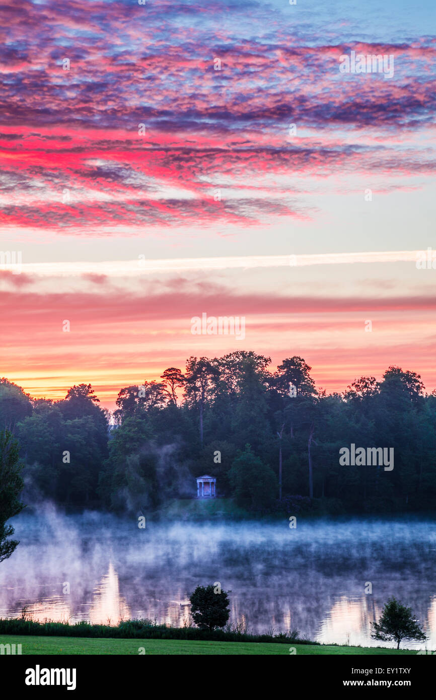 Sunrise over the Doric Temple and lake in the grounds of the Bowood Estate in Wiltshire. Stock Photo