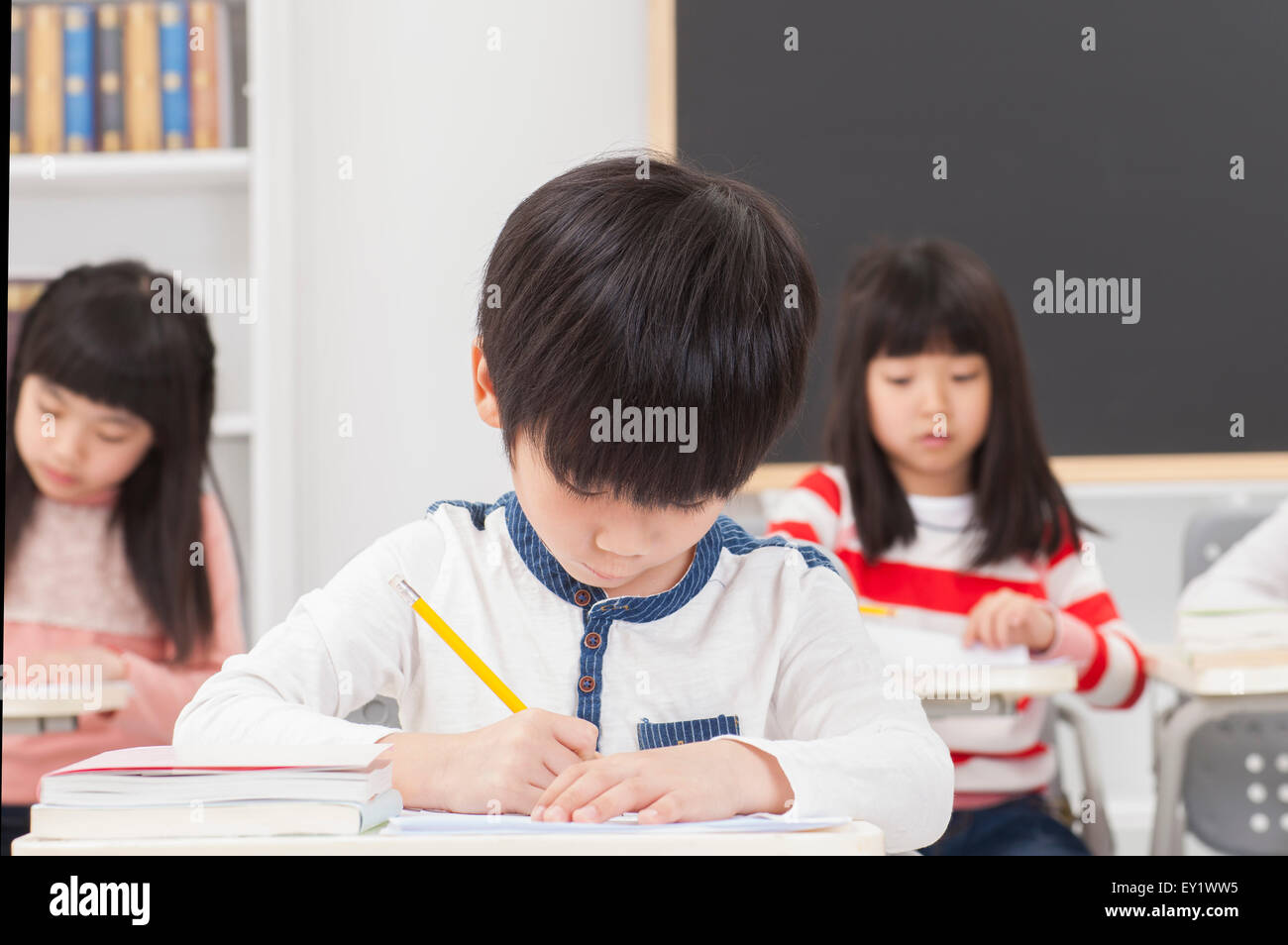 Children sitting in the classroom and studying Stock Photo - Alamy
