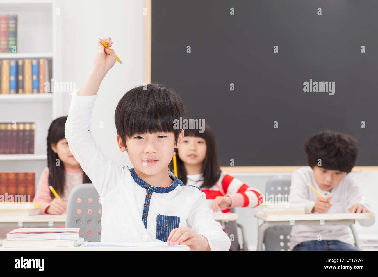 Children sitting in the classroom and studying Stock Photo - Alamy