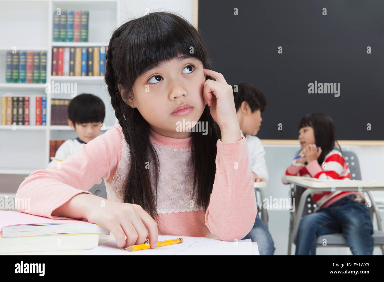 Children sitting in the classroom and studying Stock Photo - Alamy