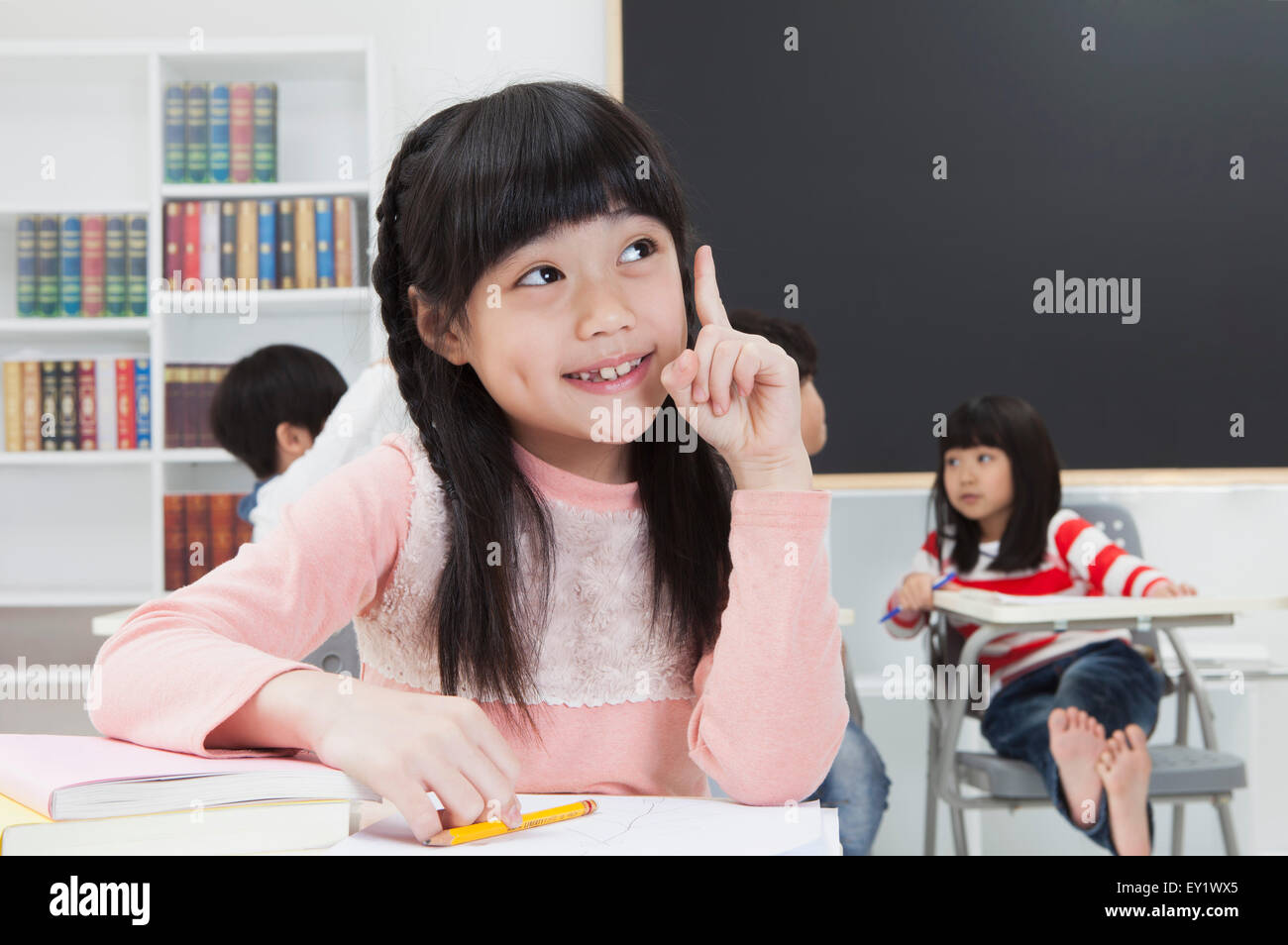 Children sitting in the classroom and studying Stock Photo - Alamy
