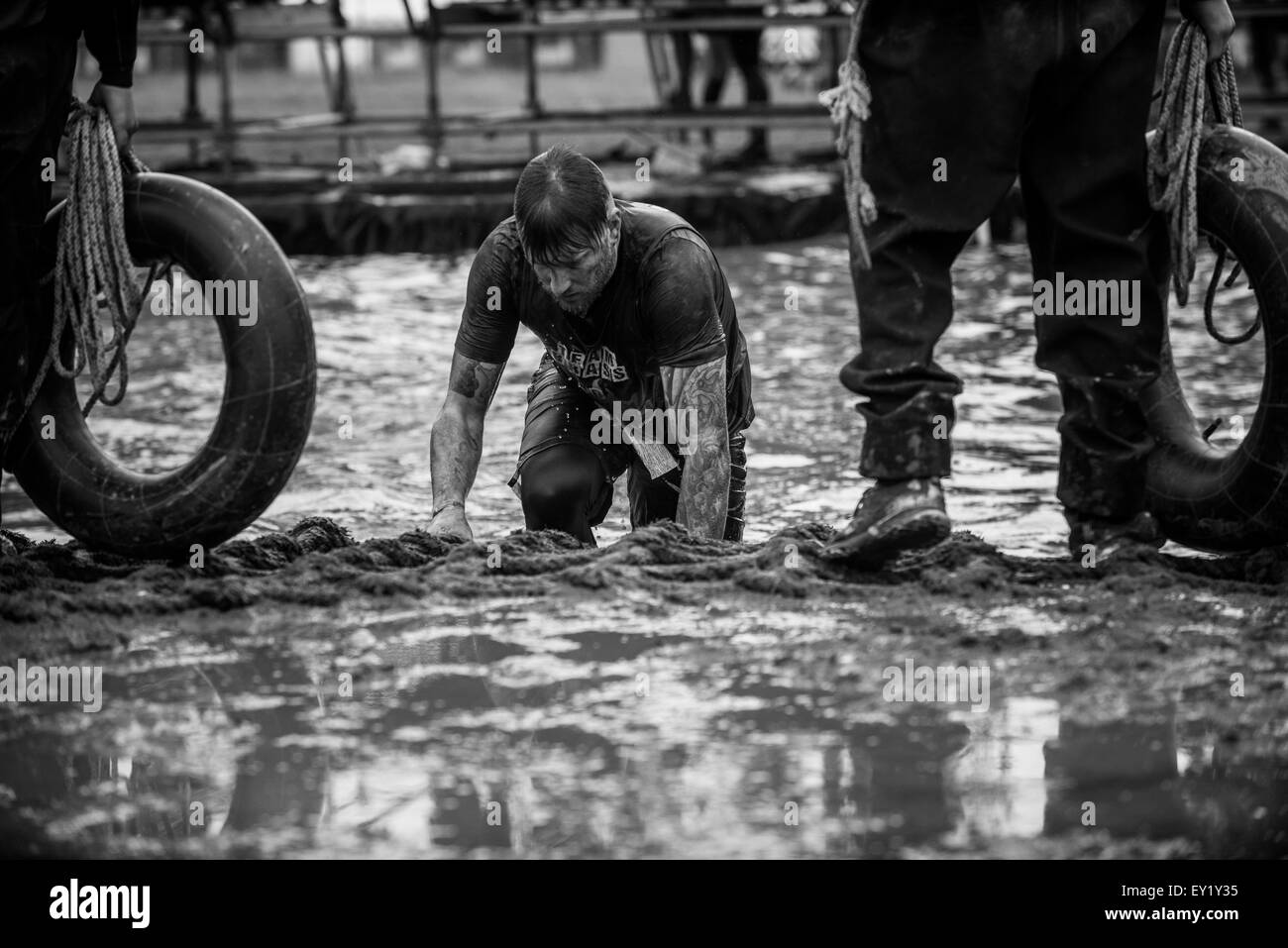 Competitors take part in the Tough Mudder Scotland at Drumlanrig Castle on June 21, 2015 in Dumfries and Galloway, Scotland. Stock Photo