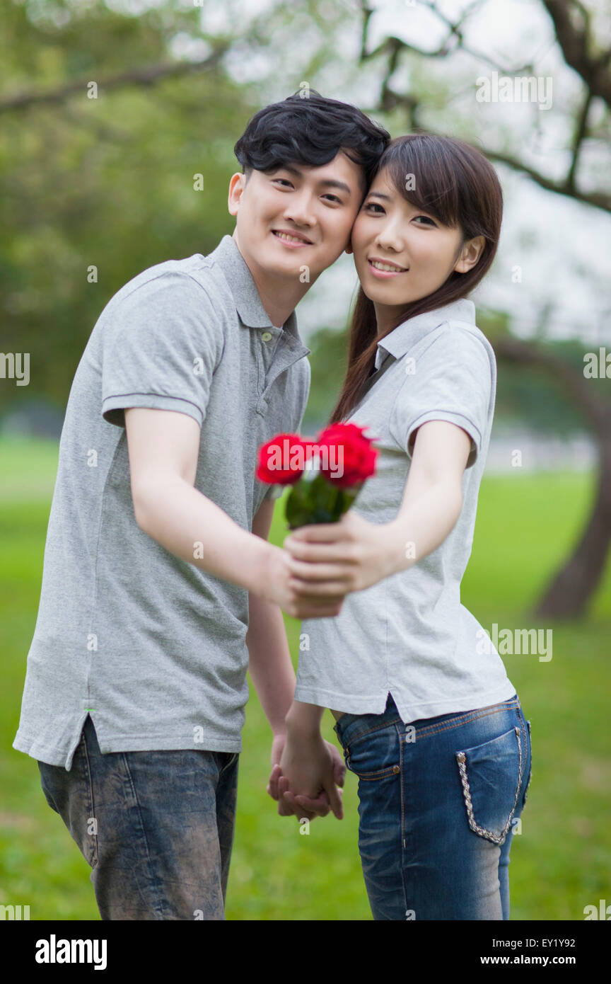 Couple with flowers hi-res stock photography and images - Alamy