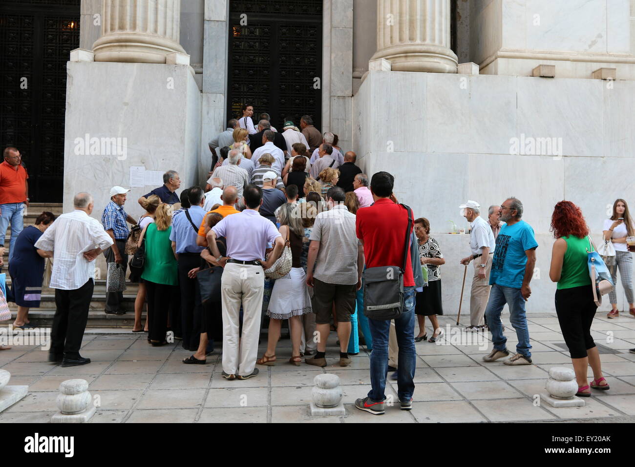 Thessaloniki, Greece. 20th July, 2015. Customers queue outside the National Bank in Thessaloniki, Greece's second city as banks reopened for the first time in three weeks. Capitals controls remain in place, and withdrawals are restricted, although the daily limit becomes weekly and is capped at 420 euros.  Credit:  Orhan Tsolak/Alamy Live News Stock Photo