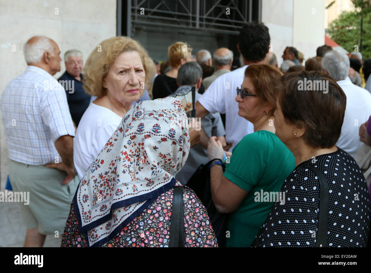 Thessaloniki, Greece. 20th July, 2015. Customers queue outside a National Bank branch in Thessaloniki, Greece's second city as banks reopened for the first time in three weeks. Capitals controls remain in place, and withdrawals are restricted, although the daily limit becomes weekly and is capped at 420 euros.  Credit:  Orhan Tsolak/Alamy Live News Stock Photo