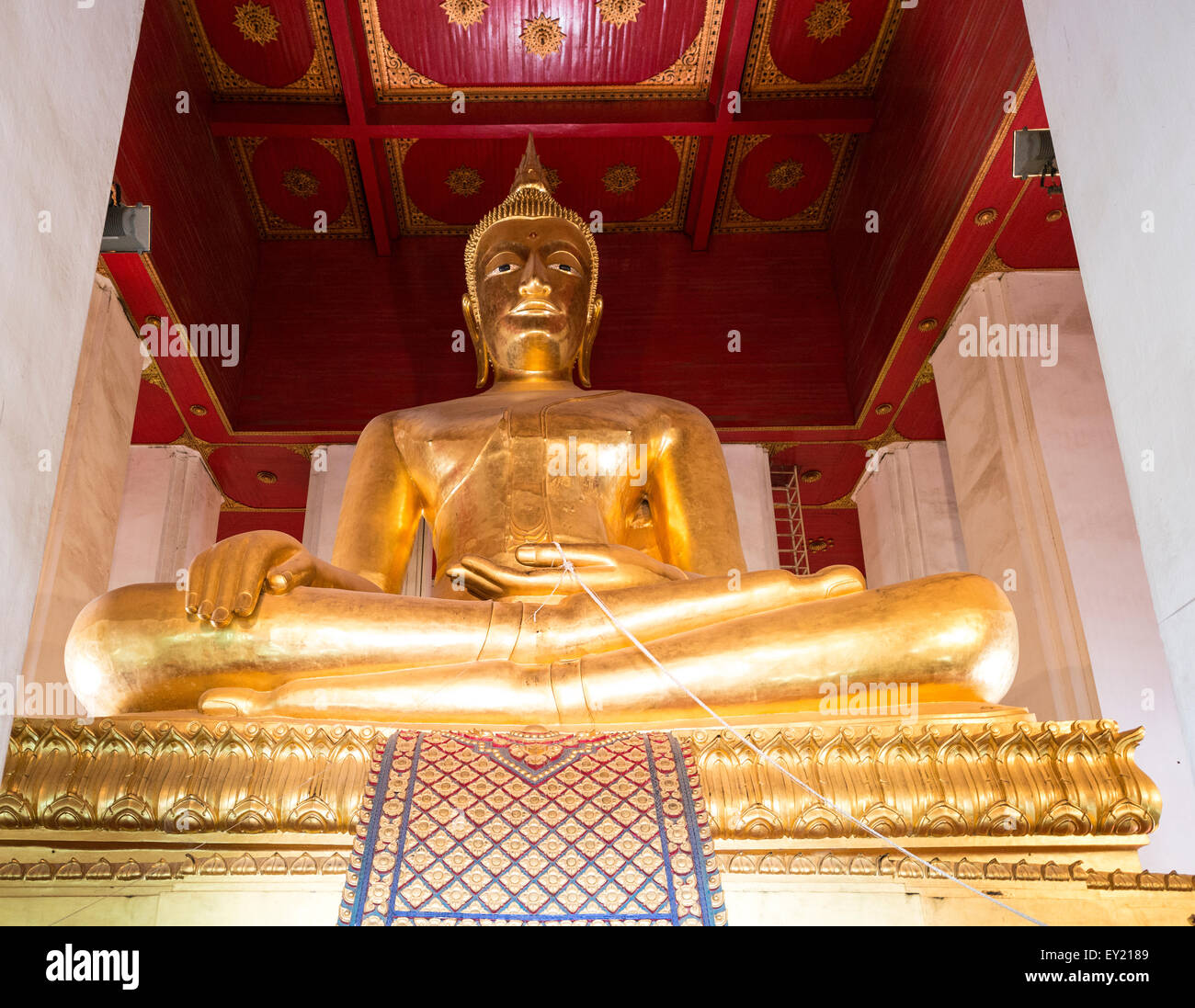Giant gilded Buddha, Buddhist temple Chang Wat Phra, Ayutthaya, Thailand Stock Photo