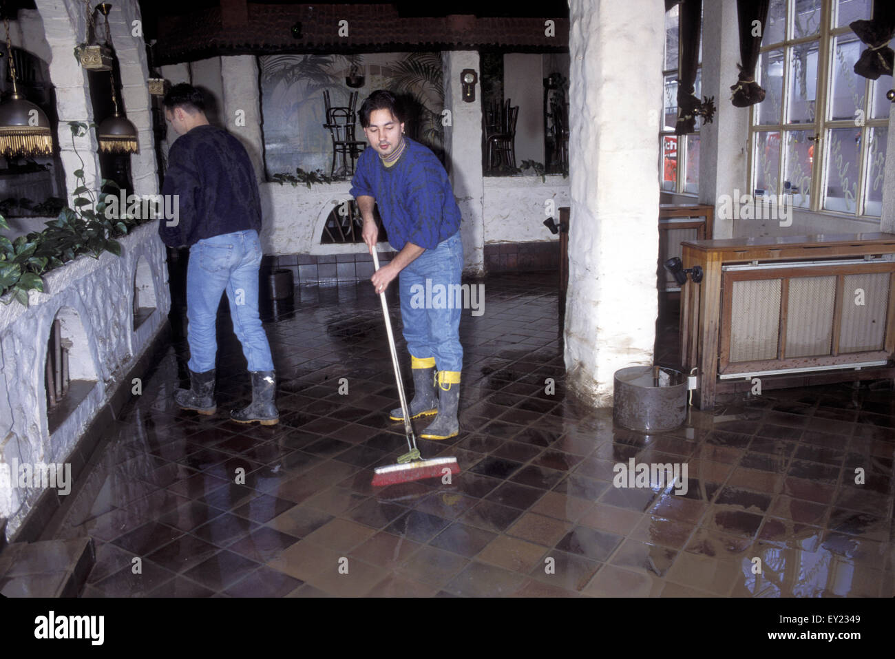 Europe, Germany, Cologne, flood of the river Rhine in January 1995, cleaning work after the flood in a restaurant in the old par Stock Photo