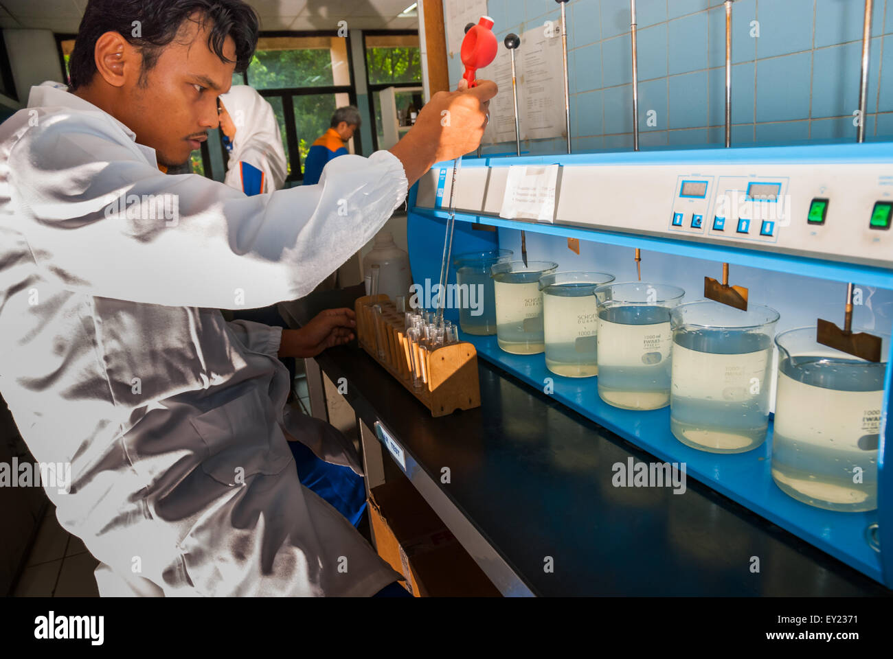 A scientist working on source water quality test lab operated by Aetra, one of Jakarta's water suppliers, in East Jakarta, Indonesia. Stock Photo