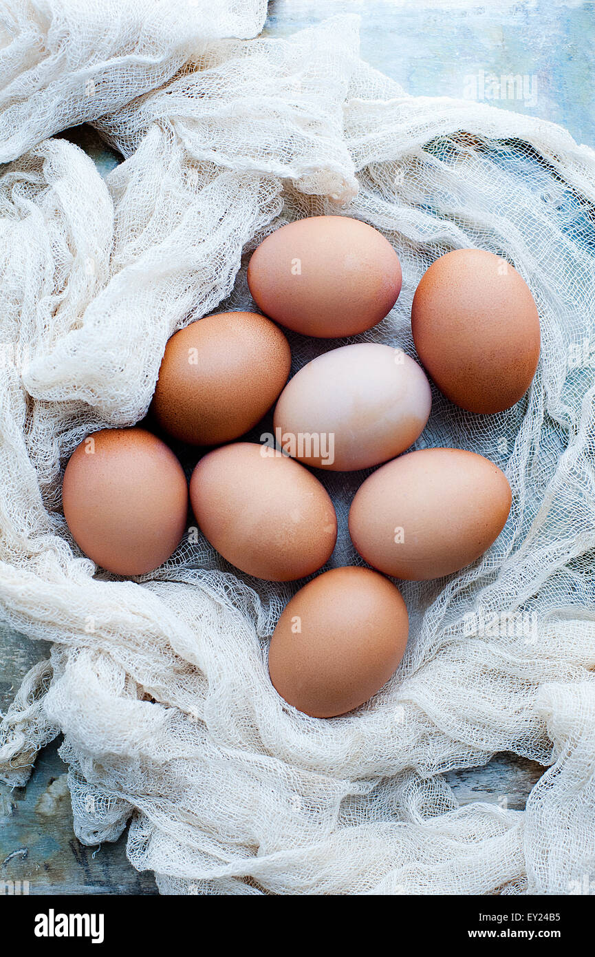Still life of fresh organic eggs on muslin Stock Photo