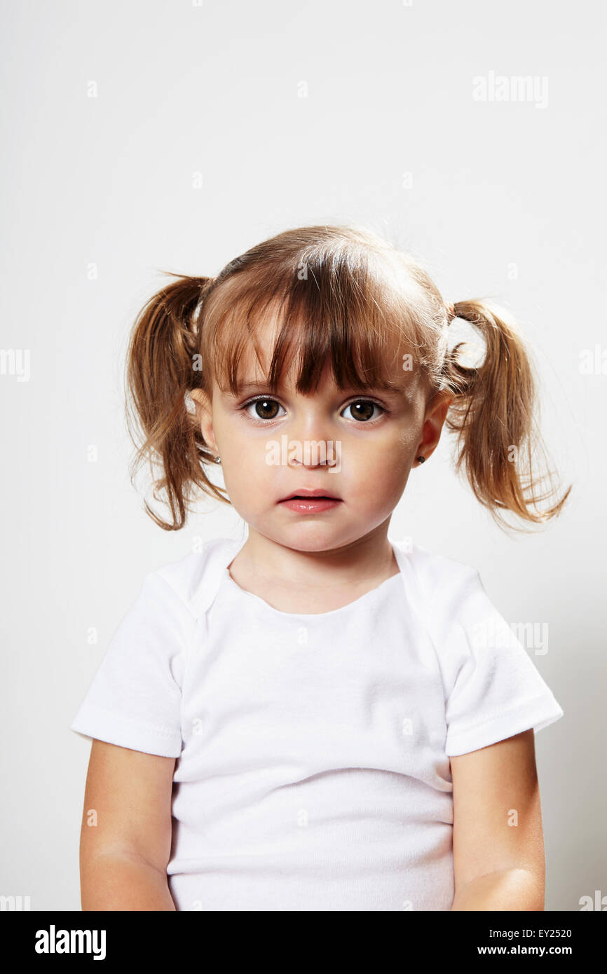 Portrait of young girl with pigtails Stock Photo