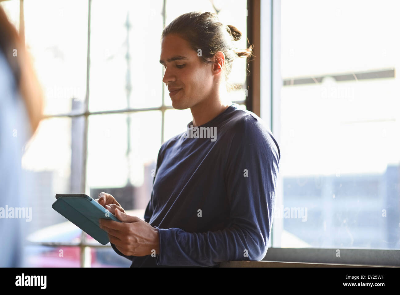 Young man using digital tablet Stock Photo