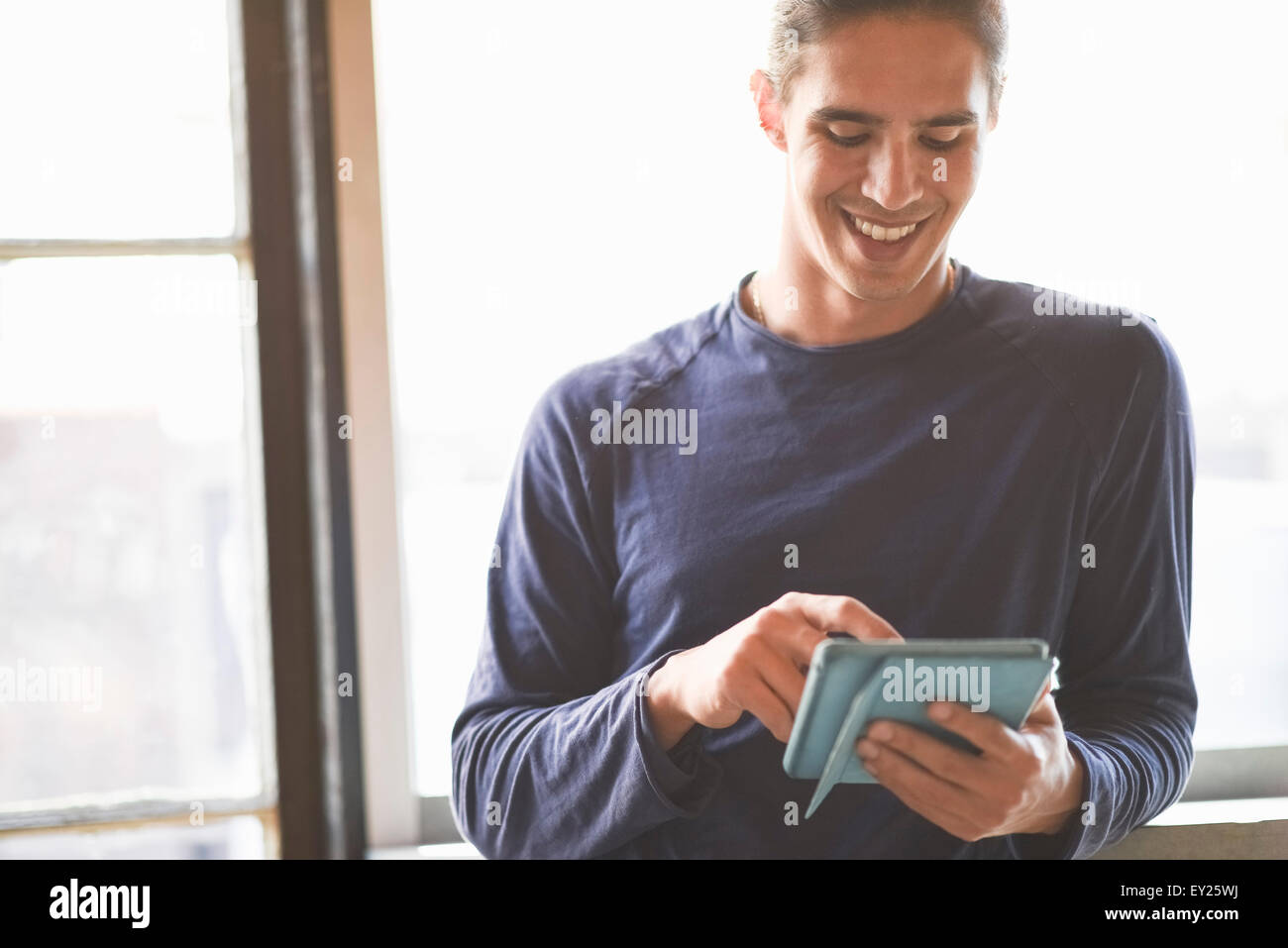 Young man using digital tablet Stock Photo