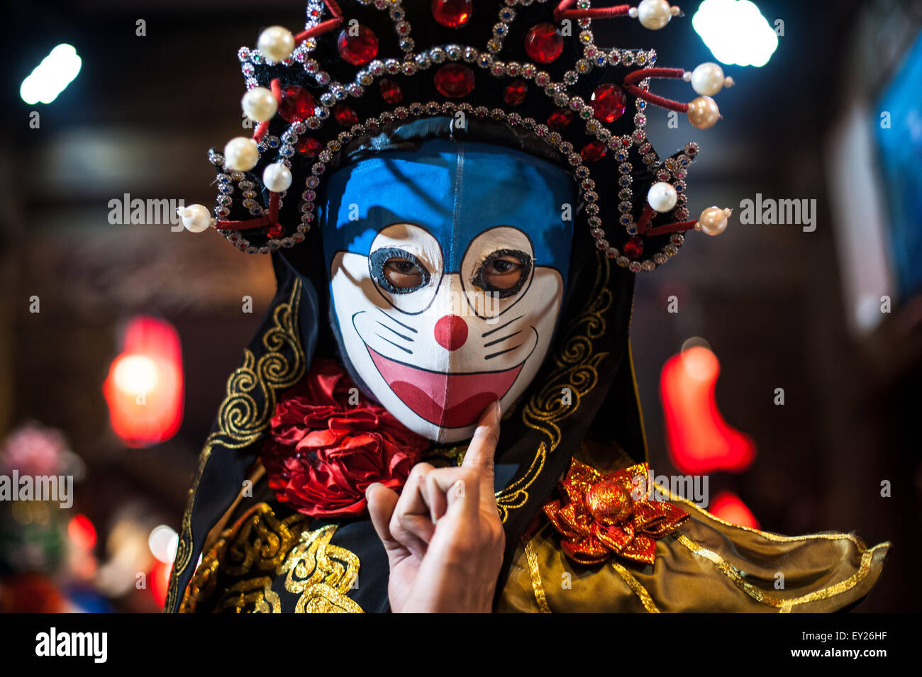 Chengdu, Sichuan Province, China - December 29, 2014: Chinese artist performs traditional face-changing art or bianlian onstage Stock Photo