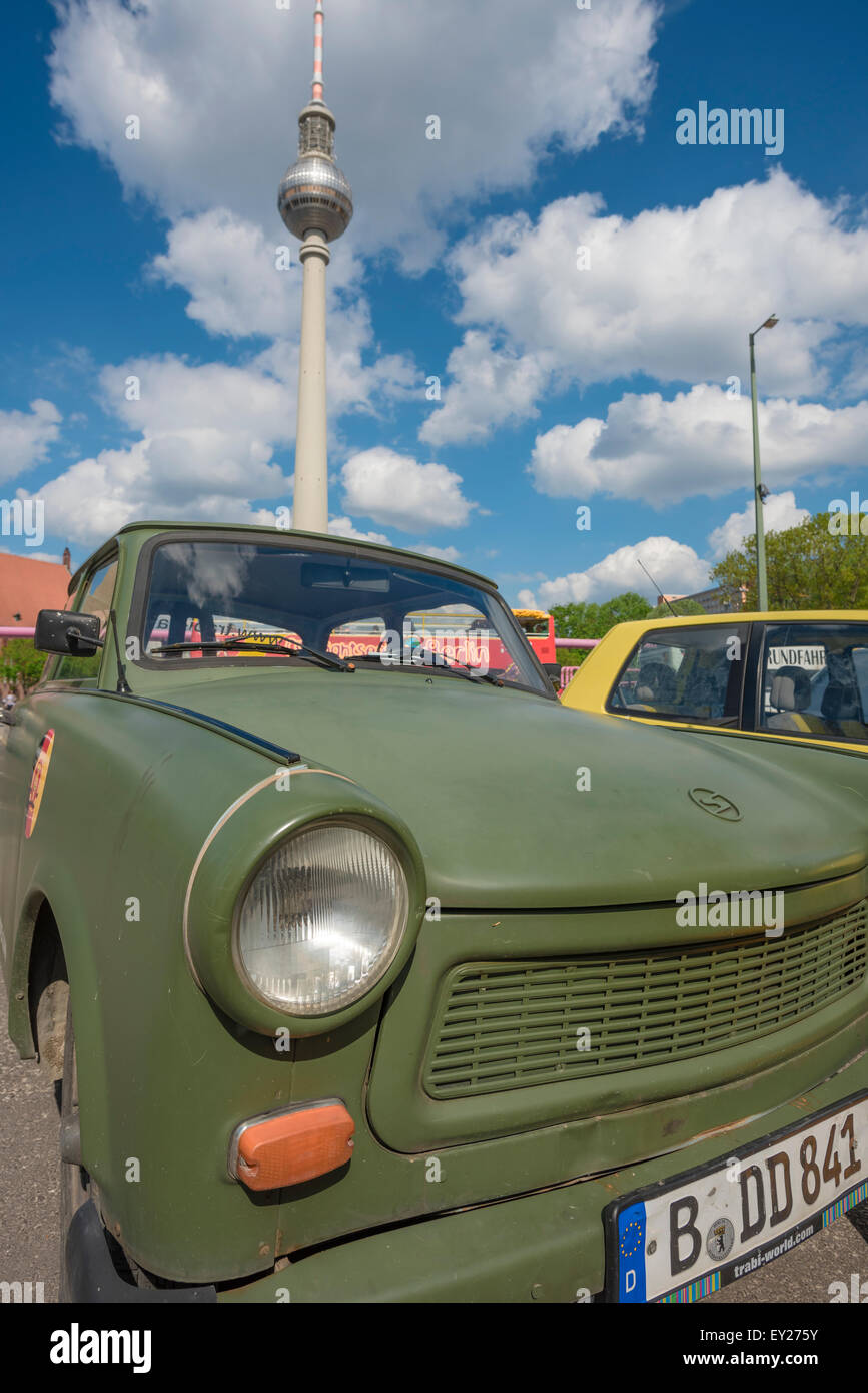 Trabant car, view of a vintage cold-war era Trabant -or 'Trabi'- parked near the Fernsehturm tower in Alexanderplatz, Berlin, Germany Stock Photo