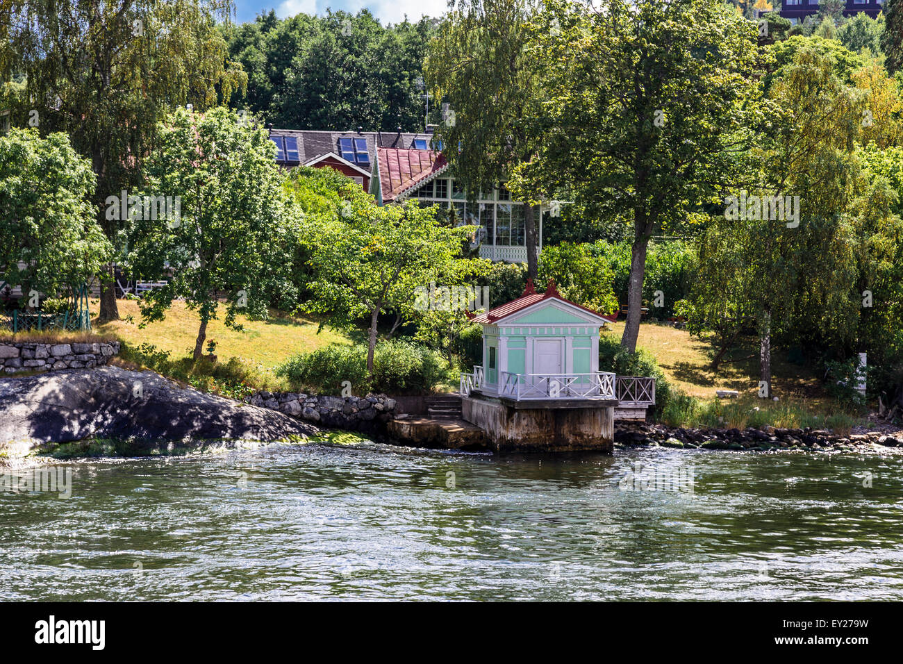 Houses and boatshed on waterfront Stockholm archipelago in summer, Sweden Stock Photo