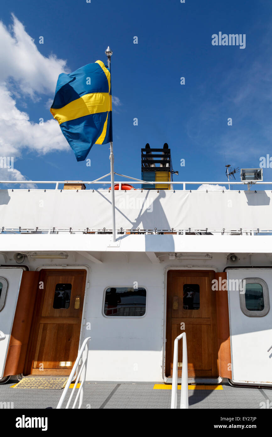 Swedish flag on ferry boat in Stockhom archipelago, Sweden Stock Photo