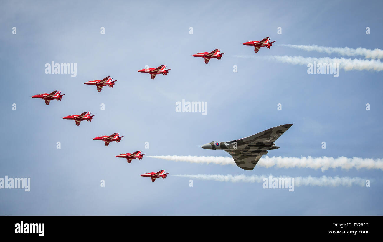 Red Arrows and Vulcan in formation at RIAT 2015 Stock Photo