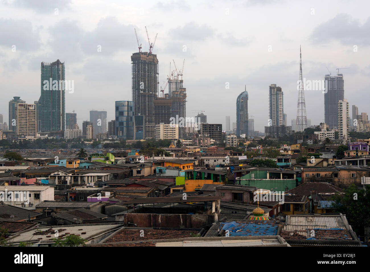Mumbai City Skyline with Slum houses & skyscrapers highrise buildings in the background Stock Photo