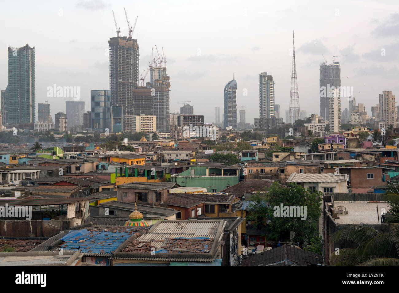 Mumbai Skyline with Slum houses & skyscrapers highrise buildings in the background Stock Photo