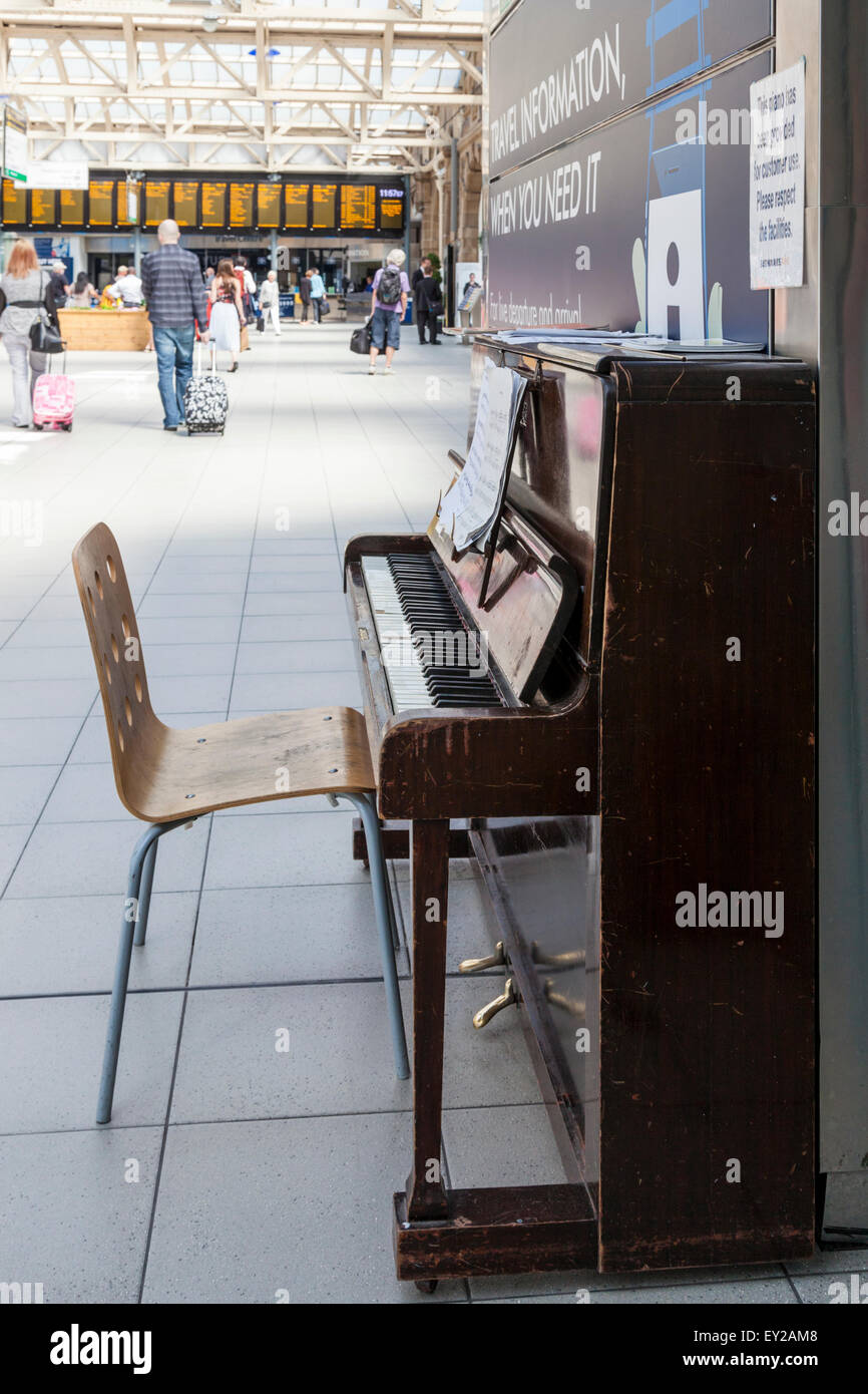 Old upright piano for the public to play at Sheffield Railway Station, Sheffield, England, UK Stock Photo